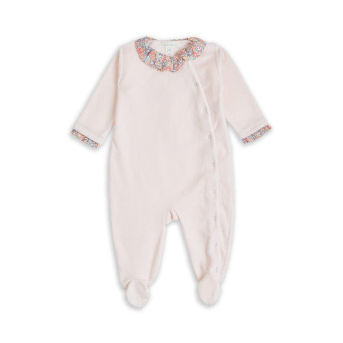 Pink velour baby sleepsuit with liberty print ruffle collar , liberty print angel wings and ruffle around the sleeve comes in a beautiful Marie Chantal gift box a