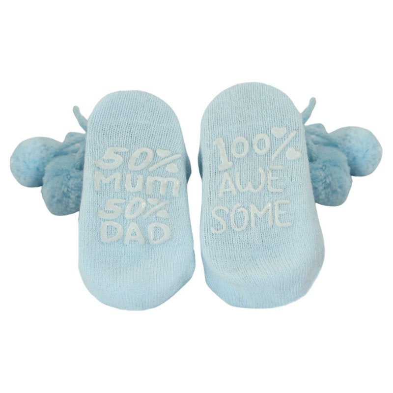 Blue Baby Pompom Socks With Cute Writing On The Sole