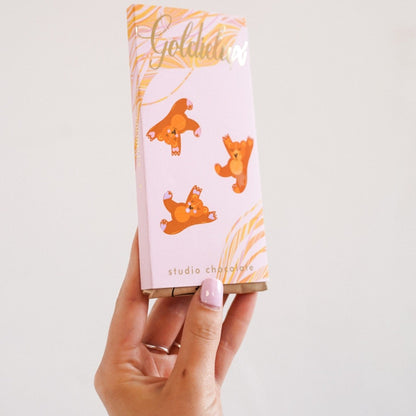 luxury wrappoed bar of chocolate with fairytale theme, pink wrapping with teddy bears 